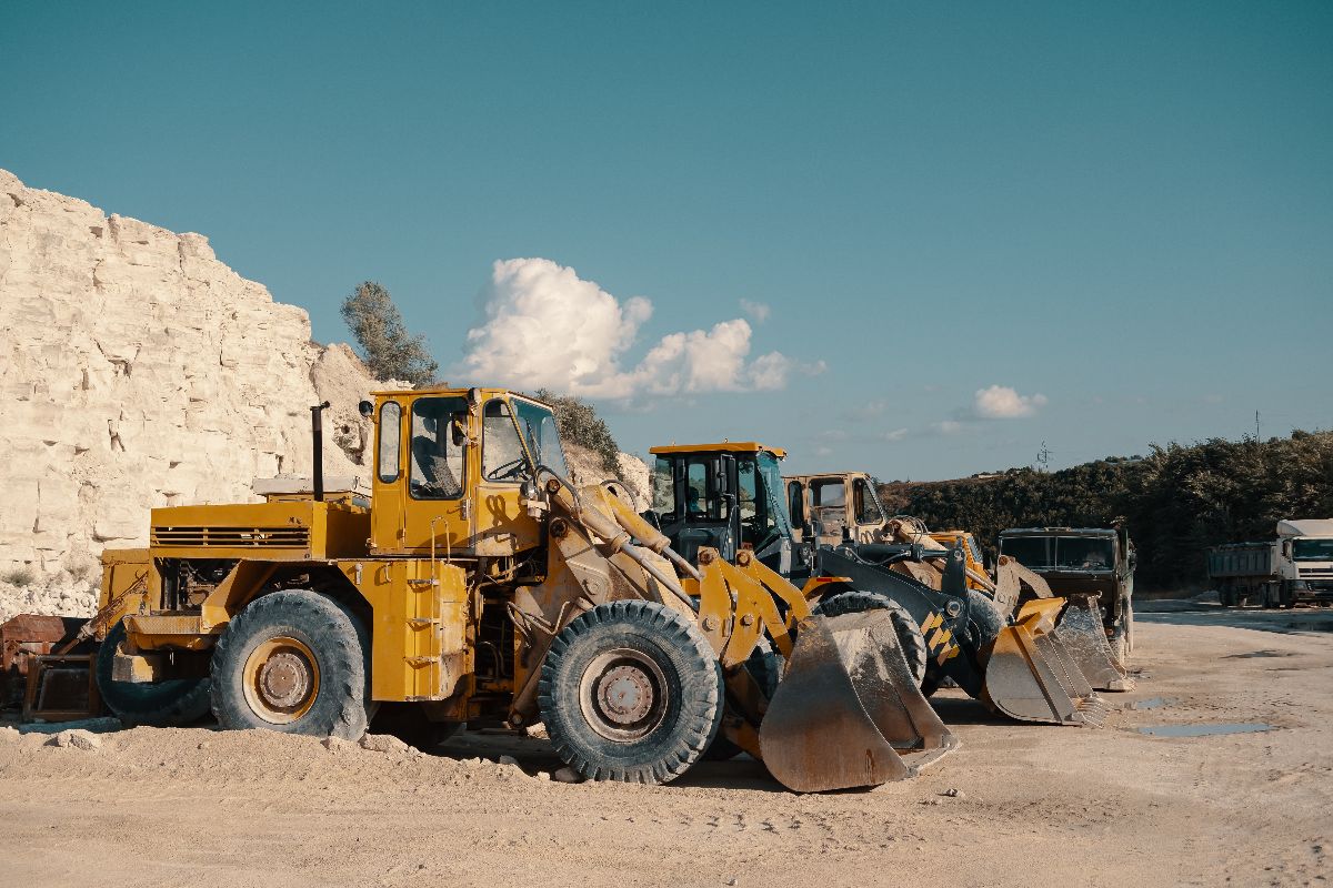 Heavy machinery lined up, ready for use on a construction site