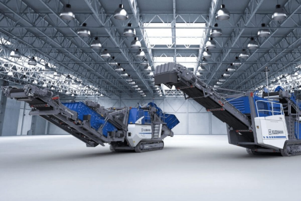 Multico stone crushing equipment displayed in warehouse, ready for rental and deployment in mining, quarry, and construction projects.