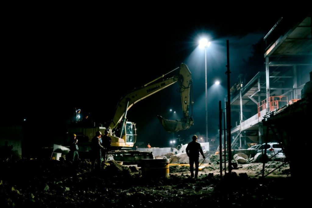 Construction site experiencing a total blackout during active operations, highlighting the impact of power outages on productivity.